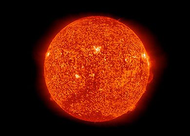 The sun displayed in dark orange wavelengths of light. Courtesy of NASA.