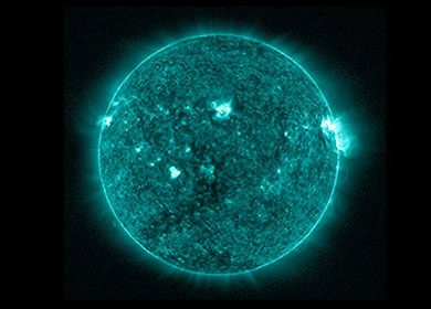 A filtered image of the sun comprised of teal wavelengths of light. Courtesy of NASA.